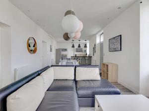 a living room with a blue and white couch at Appartement Hendaye, 4 pièces, 6 personnes - FR-1-2-346 in Hendaye