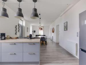 a kitchen with white cabinets and a long hallway at Appartement de Charme avec Jardin et Terrasse au Centre d'Hendaye, à 2 km de la Plage - FR-1-2-346 in Hendaye +9 photos