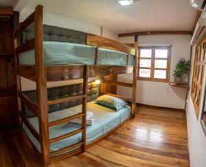 a bunk bed room with two bunk beds at Rancho Mila in San Vicente