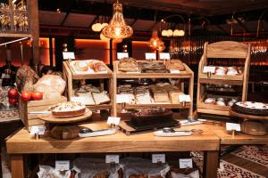 a bakery with many different types of cakes and pastries at BLESS Hotel Madrid - The Leading Hotels of the World in Madrid