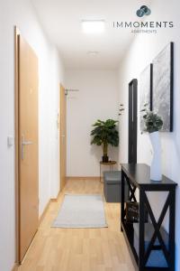 TV a/nebo společenská místnost v ubytování Appartement mit Netflix, Boxspringbett & Terrasse WE 17