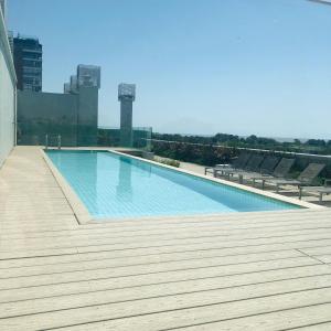 a large swimming pool on top of a building at Edificio fresh pampa in Buenos Aires
