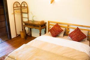Postel nebo postele na pokoji v ubytování 古民家宿Tani House Itaya -セルフチェックイン