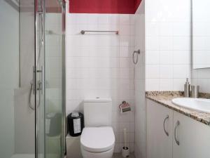 a bathroom with a toilet and a shower and a sink at Studio Hendaye, 1 pièce, 4 personnes - FR-1-2-286 in Hendaye