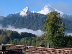 a view of a mountain with snow capped mountains at Alpenvilla Berchtesgaden Appartements in Berchtesgaden