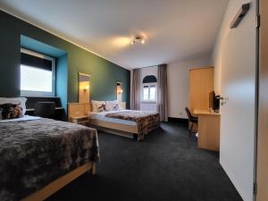 Postel nebo postele na pokoji v ubytování Hotel Kiepenkerl