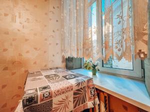 a bedroom with a bed sitting next to a window at Apartment - Independence Square in Kyiv