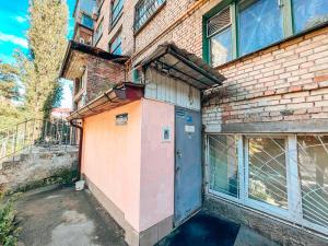 a door on the side of a brick building at Guest House near Railway Station in Kyiv