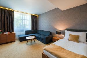 Postel nebo postele na pokoji v ubytování Hotel Větruše
