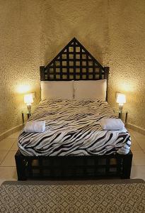 En eller flere senge i et værelse på Castillo Inspiracion Hostel