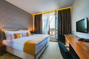 TV a/nebo společenská místnost v ubytování Hotel Větruše
