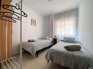 Posteľ alebo postele v izbe v ubytovaní Apartamento Felipe Neri 10