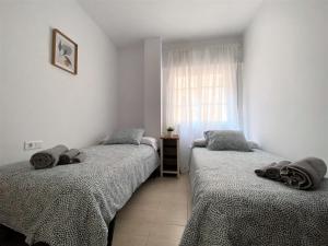 Posteľ alebo postele v izbe v ubytovaní Apartamento Felipe Neri 10