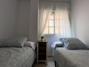 Posteľ alebo postele v izbe v ubytovaní Apartamento Felipe Neri 10