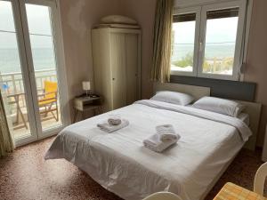 Кровать или кровати в номере Sunset view Rooms