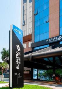 a hotel sign in front of a building at Flat Guarulhos in Guarulhos
