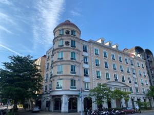 a large building with a dome on top of it at CHECK inn Select Taipei Nangang in Taipei