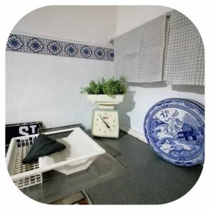 a room with a table and a blue and white plate at Booiskraal Farm Stay Accommodation in Beaufort West