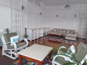 a living room with a couch and a table at Casa Encanto Homestay in Shillong