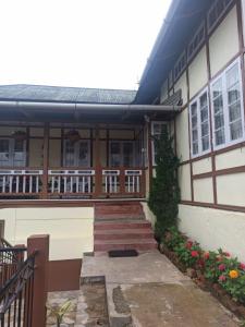 a house with stairs leading to the front of it at Casa Encanto Homestay in Shillong