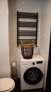 a washing machine with a basket on top of it at ZŁOTA KOBIETA in Warsaw +21 photos