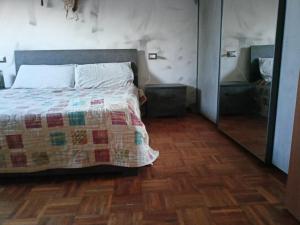 Ένα ή περισσότερα κρεβάτια σε δωμάτιο στο Casa Manzoni