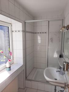 Ein Badezimmer in der Unterkunft Hotel JUMAs