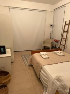 a bedroom with a bed with two towels on it at ARTEMIS 1 Bdr Down Town Nicosia By Platform 357 in Nicosia