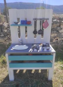 a blue and white dresser with a sink at Casa "El Villar" in Matabuena