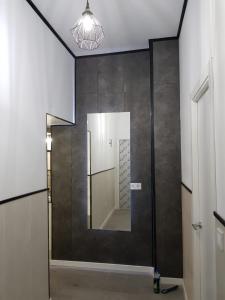 a bathroom with a mirror on the wall at Aparsol Apartments in Madrid +166 photos