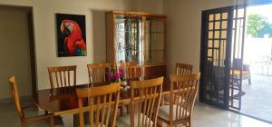 a dining room with a wooden table and chairs at CORONADO, LAS BRISAS in Playa Coronado