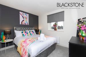 a bedroom with a white bed and a window at Avery House 4 - One Bedroom with Outdoor Terrace in Darlington
