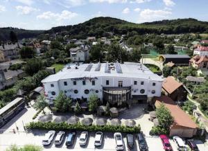 an aerial view of a large white building with parked cars at Hotel Galaktika in Lviv