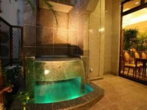a swimming pool in the middle of a building at Hotel Sun Queen - Vacation STAY 43433v in Naha