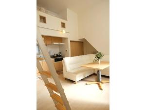 a living room with a chair and a table at Forest House - Vacation STAY 44322v in Tokyo