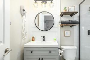 a bathroom with a sink and a mirror at Blue Mountain Hideaway at North Creek Resort in Blue Mountains +26 photos