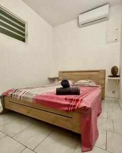 Postel nebo postele na pokoji v ubytování Villa de L'anse - bas de villa