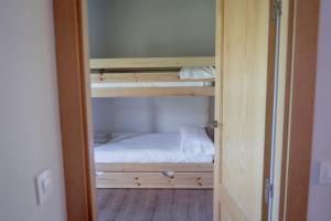 Postel nebo postele na pokoji v ubytování CASA LLOP a Paüls, Vall Fosca