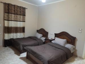Letto o letti in una camera di Aton pyramids view guest house