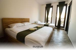 Postel nebo postele na pokoji v ubytování Museum Hotel