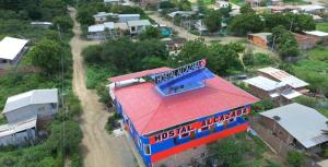an overhead view of a building with a red roof at Hostal Alcazaba in Puerto López