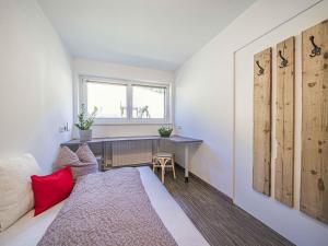 A bed or beds in a room at Gebirgsjagd