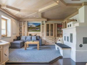 a living room with a couch and a fireplace at Gebirgsjagd in Stuhlfelden