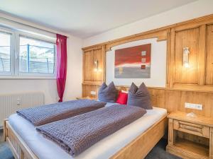 A bed or beds in a room at Gebirgsjagd