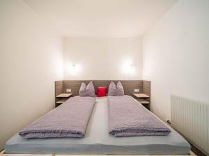 A bed or beds in a room at Gebirgsjagd
