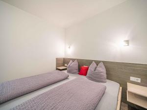 A bed or beds in a room at Gebirgsjagd