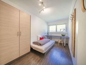 A bed or beds in a room at Gebirgsjagd