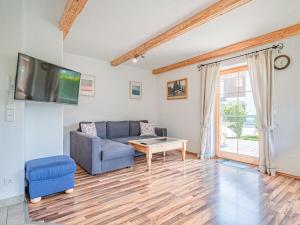 a living room with a couch and a table at Haus Sarah in Hopfgarten im Brixental
