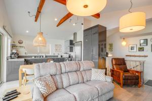 a living room with a couch and a table at CrowsNest in Oceanside