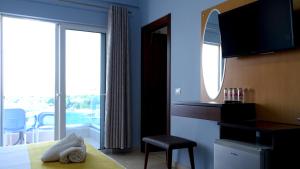 Postel nebo postele na pokoji v ubytování Hotel De Luna